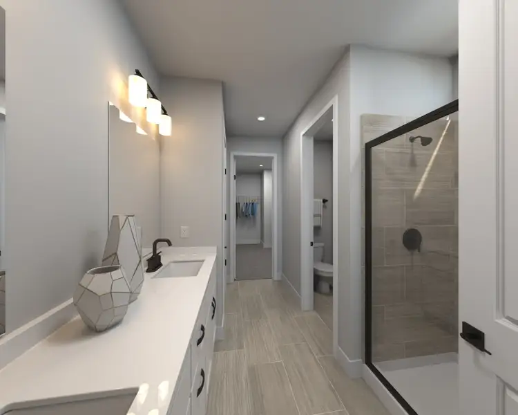 The primary bathroom offers dual vanity sinks and a walk-in shower.