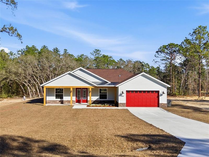 Front exterior of a new home in , Dunnellon, FL, highlighting curb appeal (Image 22).