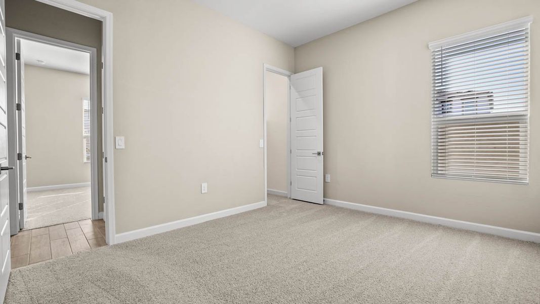 Spacious, unfurnished interior of a new home in Zanjero Pass, Waddell (Image 37).