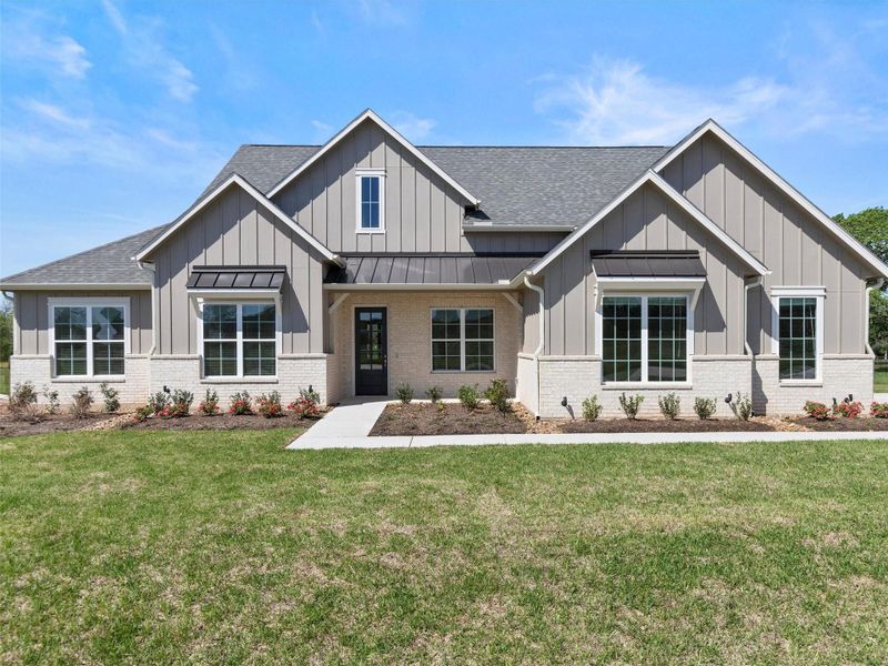 Front exterior of a new home in , Smithville, TX, highlighting curb appeal (Image 22).