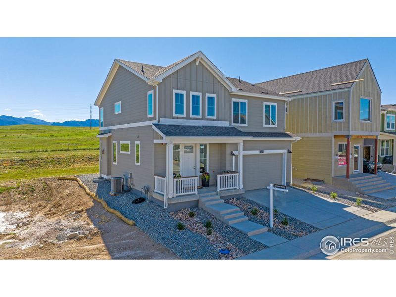 Home is fully landscaped and backs to Boulder County Open Space and has Mountain views from the living area and 2 of the 5 bedrooms.