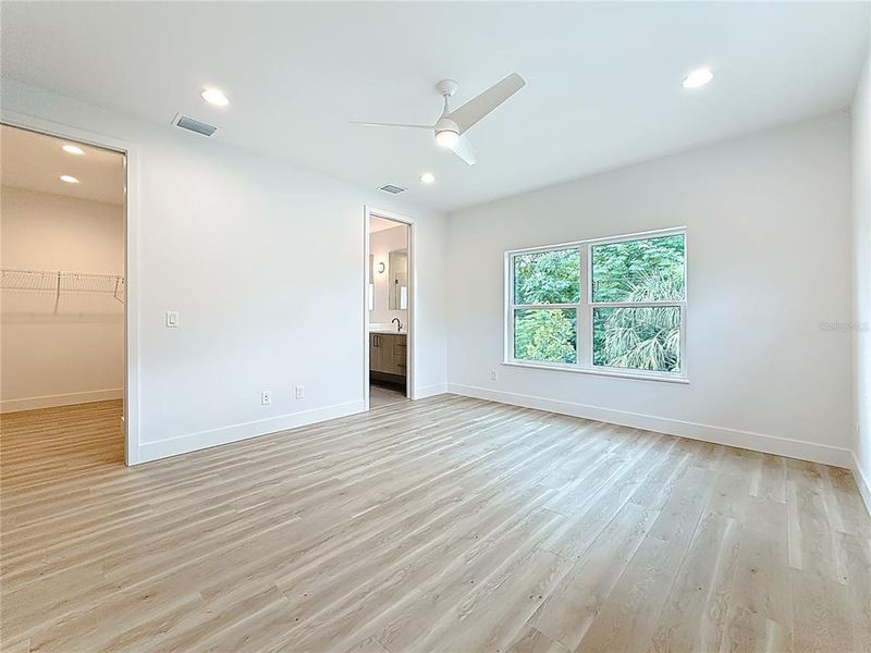 Elegant Primary Bedroom upstairs featuring a sleek en suite bath and abundant natural light. Elegant Primary Bedroom upstairs featuring a sleek en suite bath and abundant natural light.