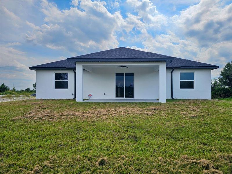 Front exterior of a new home in , Lehigh Acres, FL, highlighting curb appeal (Image 1).