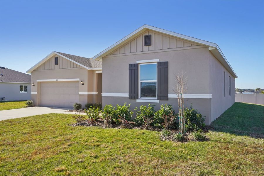 Front exterior of a new home in Silver Lake Estates II, Leesburg, FL, highlighting curb appeal (Image 16). Front exterior of a new home in Silver Lake Estates II, Leesburg, FL, highlighting curb appeal (Image 16).