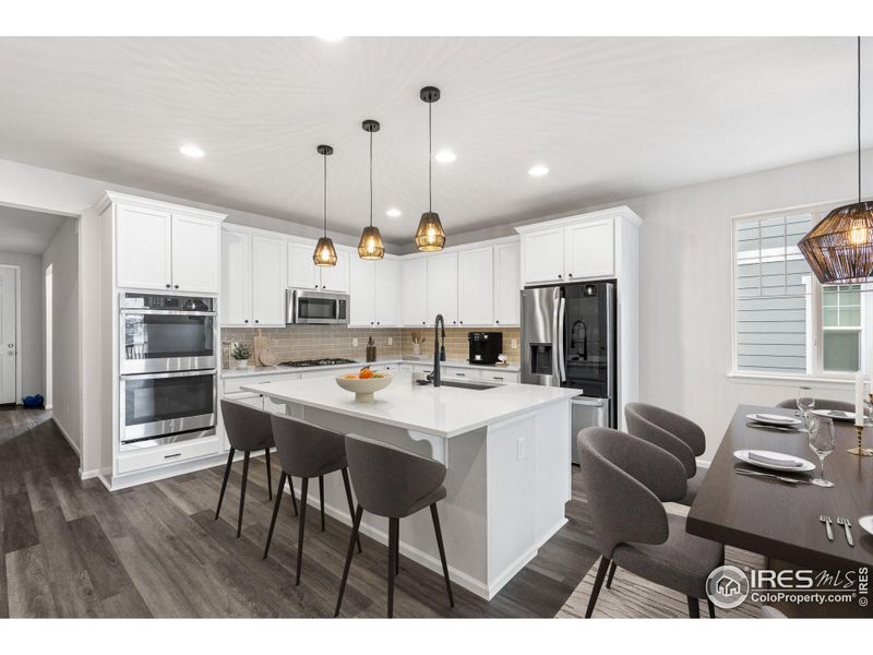 This photo has been virtually staged to provide visual ideas for how furniture can be arranged in this area of the home.