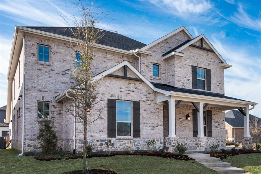 Front exterior of a new home in Villages of Creekwood, Frisco, TX, highlighting curb appeal (Image 21).