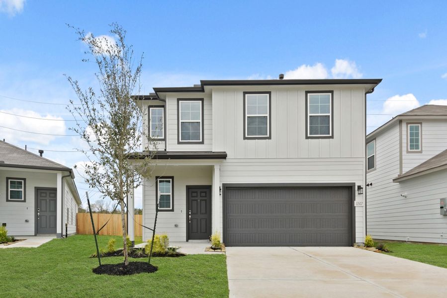 Front exterior of a new home in Barrett Crossing, Crosby, TX, highlighting curb appeal (Image 18).