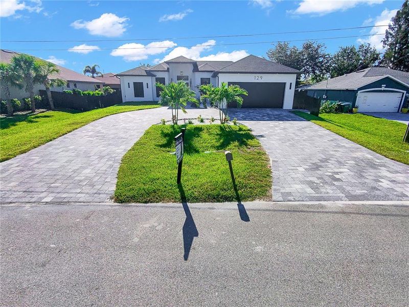 Front exterior of a new home in , Cape Coral, FL, highlighting curb appeal (Image 31).