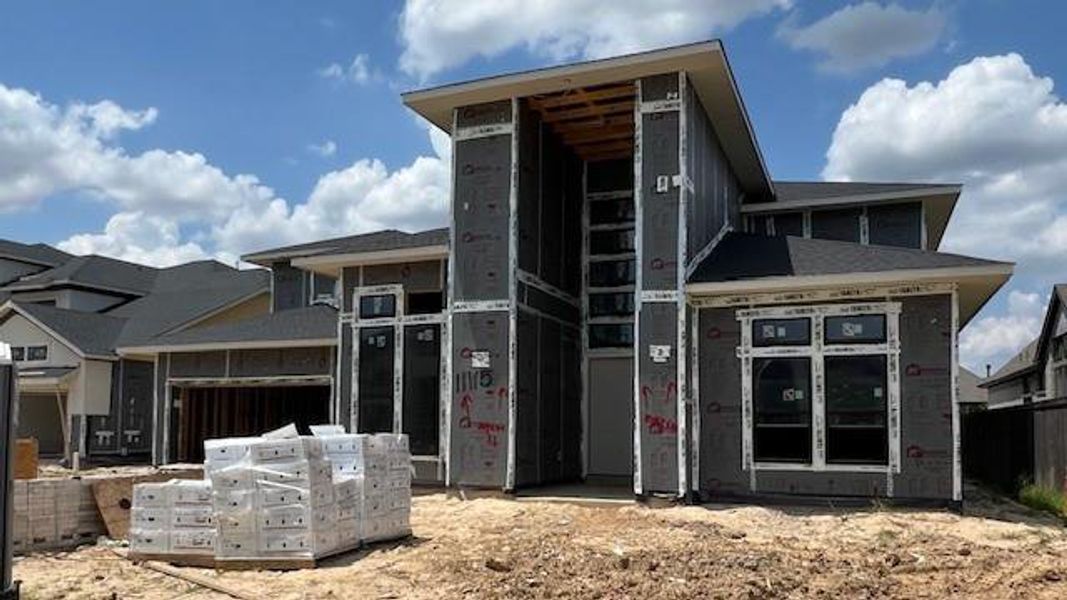 Front exterior of a new home in Bridgeland 45', 50', 70', Cypress, TX, highlighting curb appeal (Image 2). Front exterior of a new home in Bridgeland 45', 50', 70', Cypress, TX, highlighting curb appeal (Image 2).