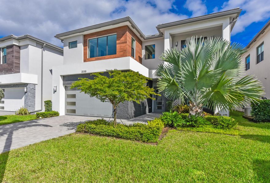 Front exterior of a new home in , Boca Raton, FL, highlighting curb appeal (Image 1). Front exterior of a new home in , Boca Raton, FL, highlighting curb appeal (Image 1).