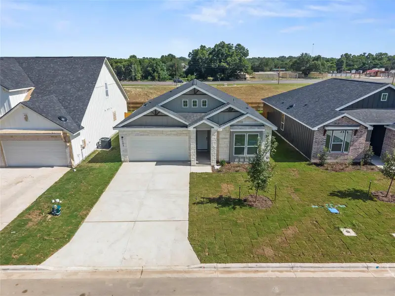 Front exterior of a new home in Rancho San Gabriel, Georgetown, TX, highlighting curb appeal (Image 16).
