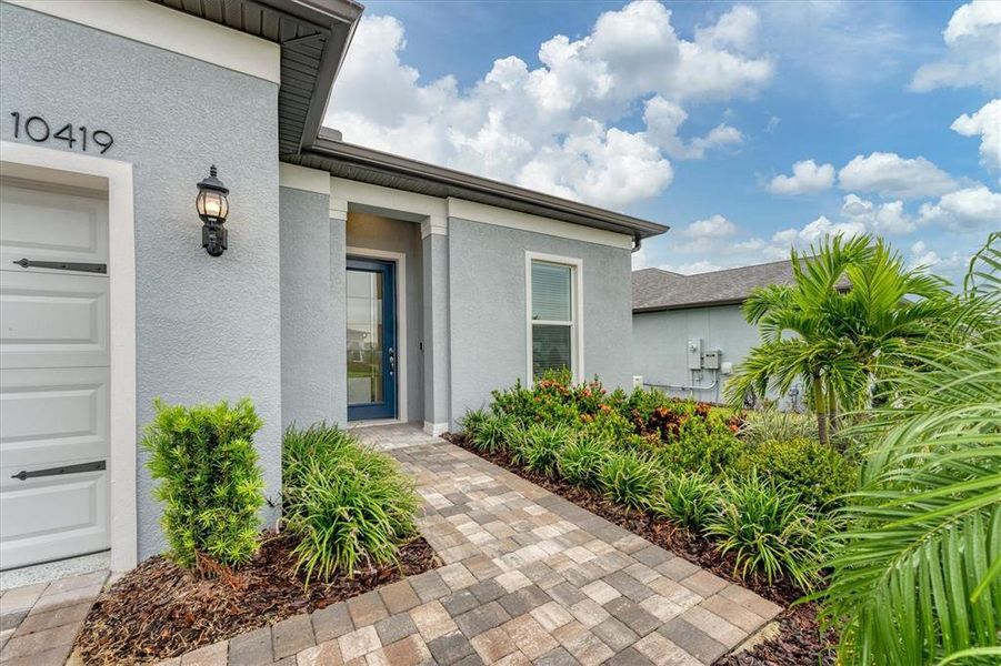 Front exterior of a new home in , Parrish, FL, highlighting curb appeal (Image 2).