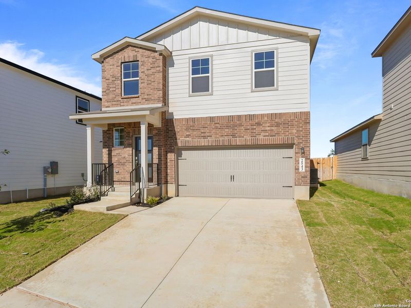 Front exterior of a new home in Applewhite Meadows, San Antonio, TX, highlighting curb appeal (Image 19). Front exterior of a new home in Applewhite Meadows, San Antonio, TX, highlighting curb appeal (Image 19).