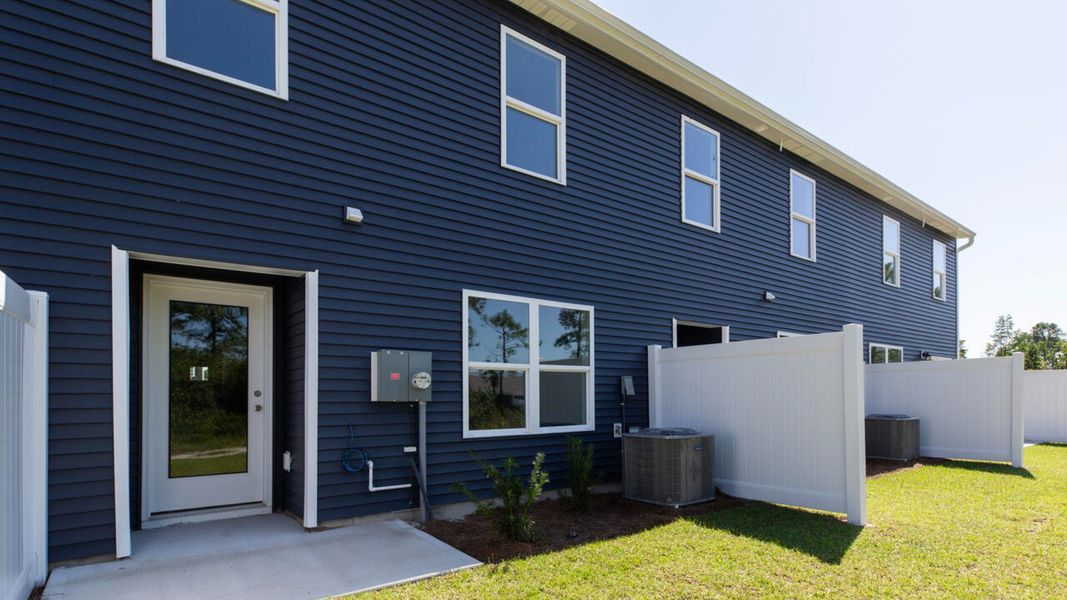 Front exterior of a new home in Waterside Townhomes, Surf City, NC, highlighting curb appeal (Image 2).