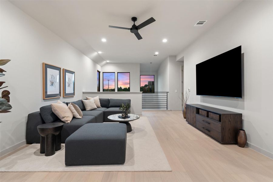 Natural light streams into this generously proportioned living room, highlighted by clean lines and modern design. Natural light streams into this generously proportioned living room, highlighted by clean lines and modern design.