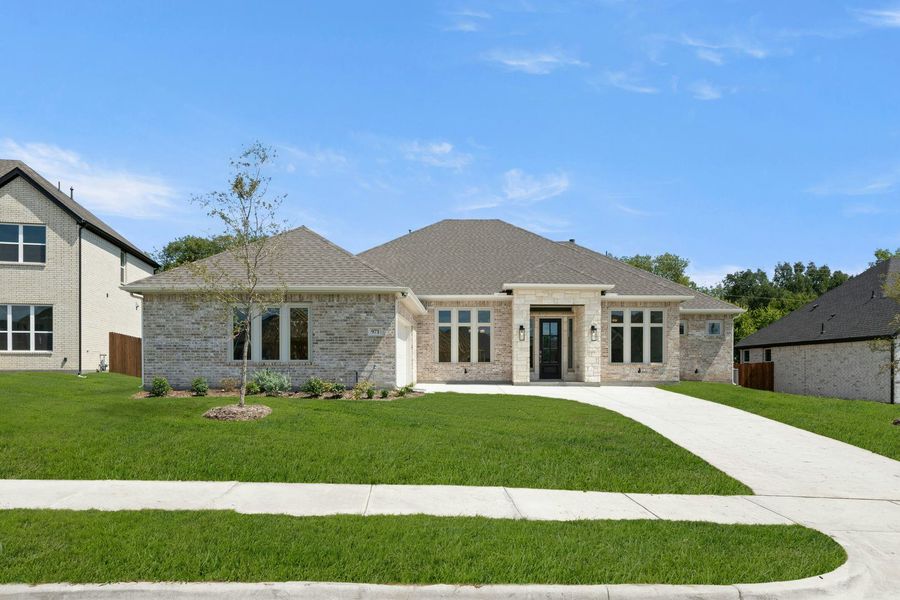 Front exterior of a new home in Kentsdale Farms, DeSoto, TX, highlighting curb appeal (Image 2).