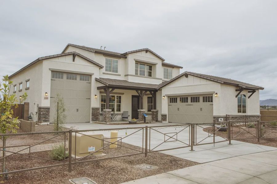 Front exterior of a new home in Valencia at Granite Vista, Waddell, AZ, highlighting curb appeal (Image 1). Front exterior of a new home in Valencia at Granite Vista, Waddell, AZ, highlighting curb appeal (Image 1).