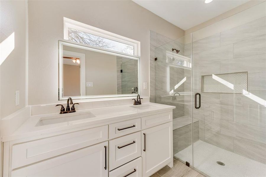 Bathroom with vanity and an enclosed shower