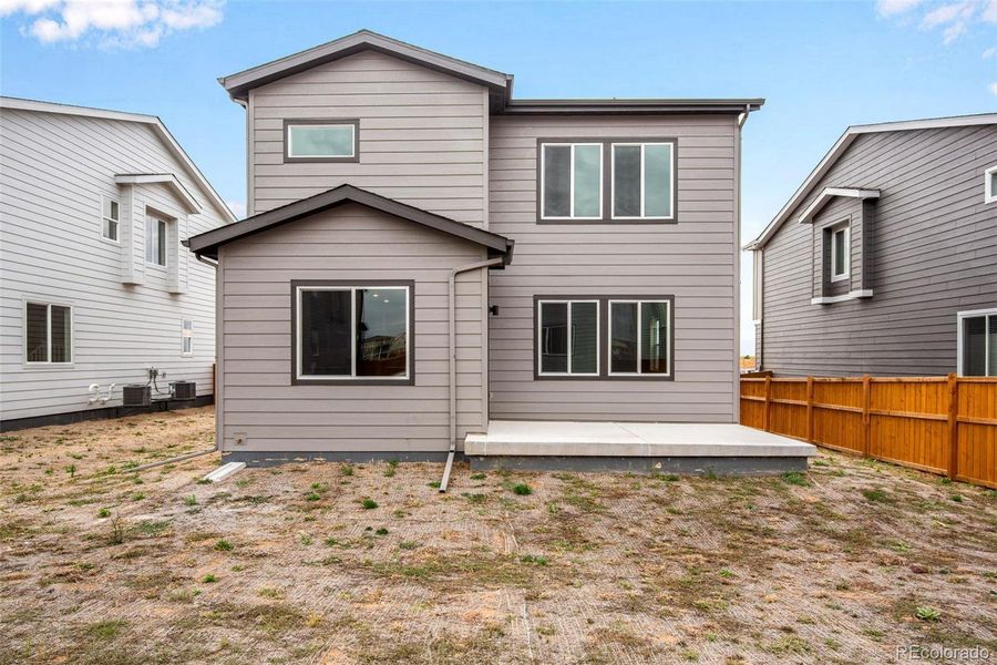 Exterior details and patio area of a home in Medley at Reunion Ridge, Commerce City (Image 1).