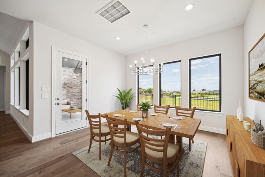 The Dining Area off the Kitchen. Back door leads to Back Porch. This photo is virtually staged. The Dining Area off the Kitchen. Back door leads to Back Porch. This photo is virtually staged.