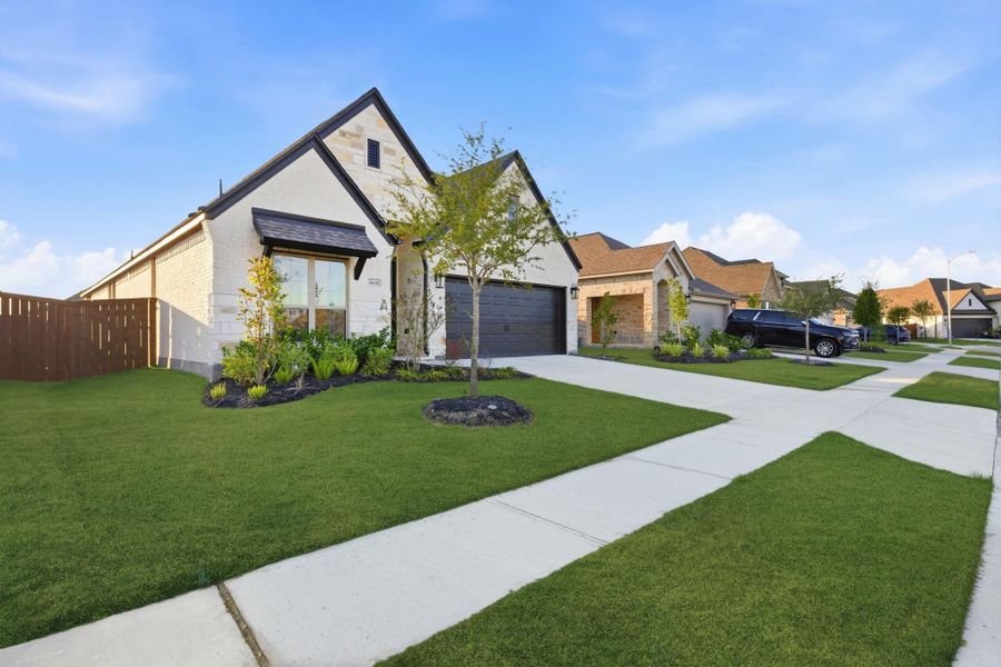 Front exterior of a new home in Meridiana 40'/45', Manvel, TX, highlighting curb appeal (Image 25).
