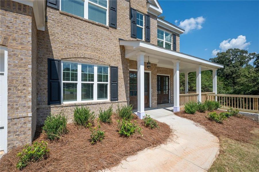 Front exterior of a new home in The Landing at Miller’s Ferry, Adairsville, GA, highlighting curb appeal (Image 1). Front exterior of a new home in The Landing at Miller’s Ferry, Adairsville, GA, highlighting curb appeal (Image 1).