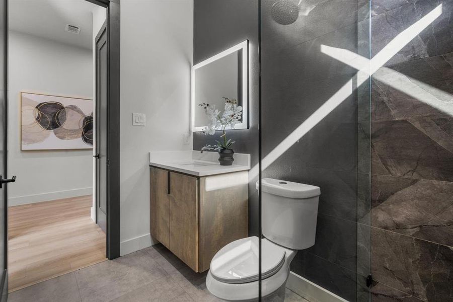 Bathroom featuring vanity and a walk in shower