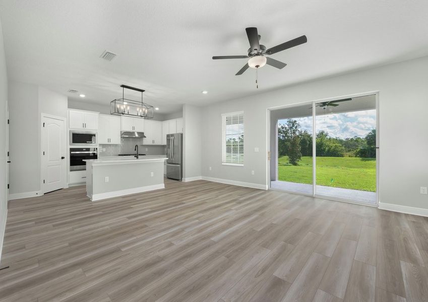 The family room flows seamlessly into the kitchen and the covered patio.