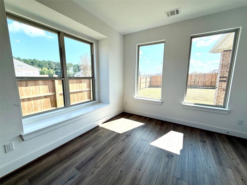 Large windows frame the space, allowing natural light to flood in, casting a cheerful ambiance that makes every meal feel special. Large windows frame the space, allowing natural light to flood in, casting a cheerful ambiance that makes every meal feel special.