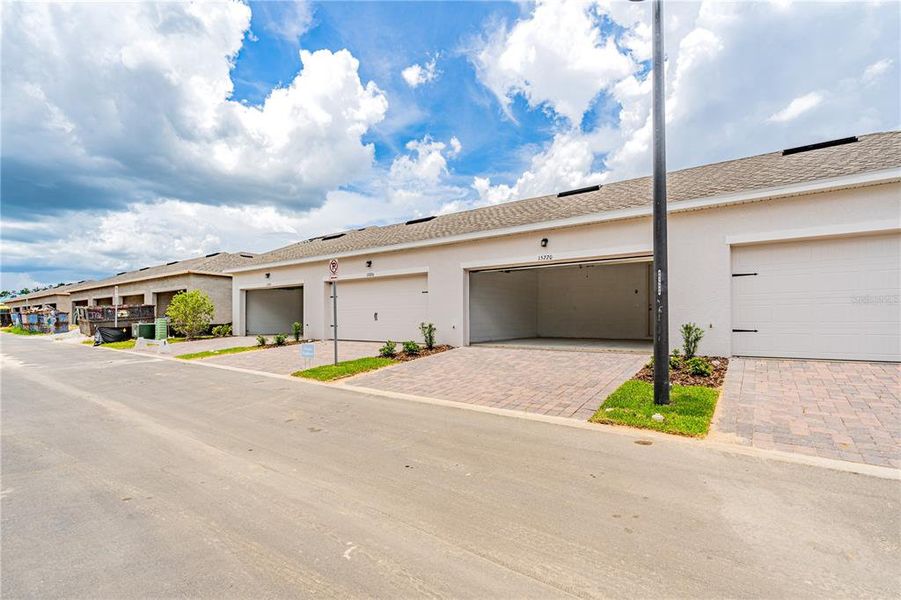 Exterior details and patio area of a home in Osprey Ranch Townhomes, Winter Garden (Image 3).