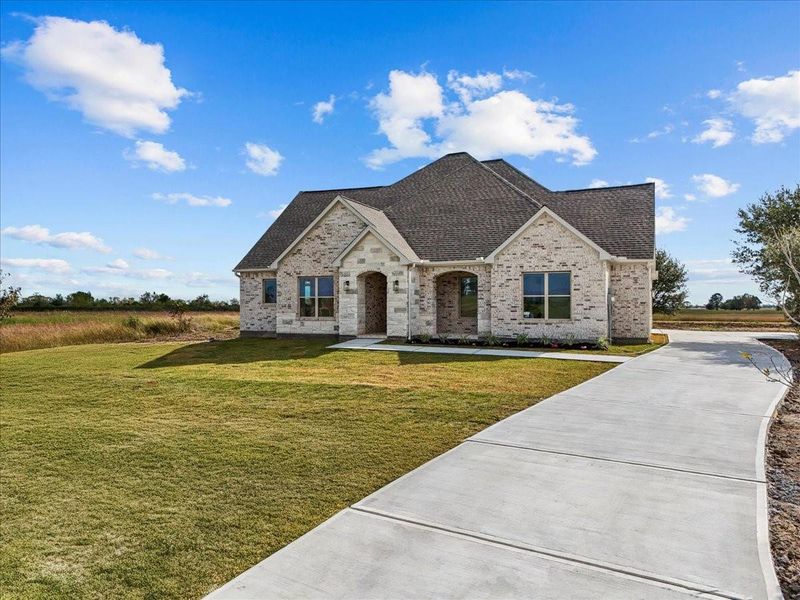 Front exterior of a new home in , Angleton, TX, highlighting curb appeal (Image 26).