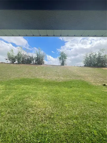 Exterior details and patio area of a home in Abbey Glen, Dade City (Image 4).