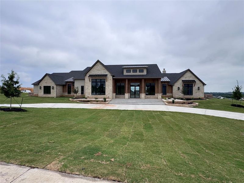 Front exterior of a new home in , Aledo, TX, highlighting curb appeal (Image 5). Front exterior of a new home in , Aledo, TX, highlighting curb appeal (Image 5).