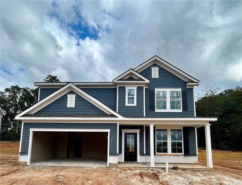 Front exterior of a new home in Sutton's Landing, Statham, GA, highlighting curb appeal (Image 21).