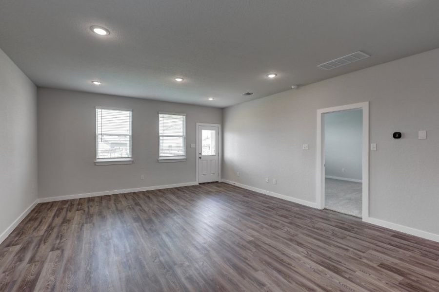 A room with a wood floor and a wood floor. A room with a wood floor and a wood floor.