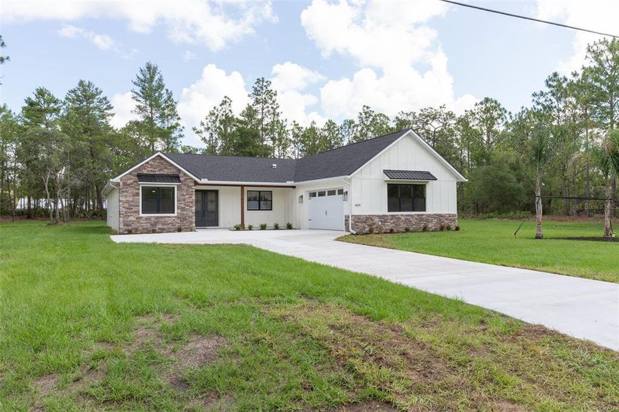 Front exterior of a new home in , Beverly Hills, FL, highlighting curb appeal (Image 27). Front exterior of a new home in , Beverly Hills, FL, highlighting curb appeal (Image 27).