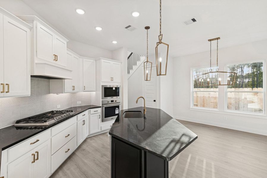 Furnished interior view inside a new home in The Highlands - Grove Collection, Porter (Image 14).