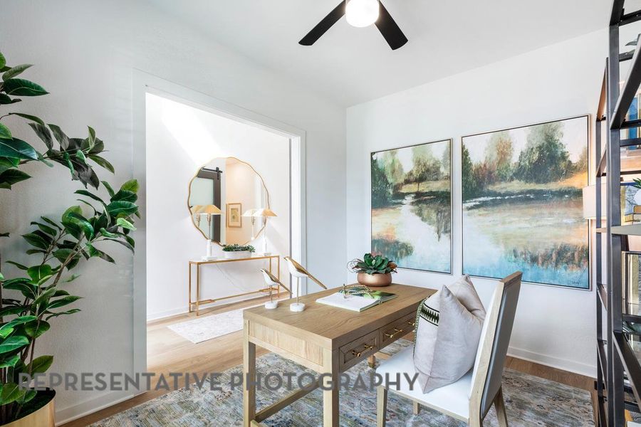 Office area with wood finished floors, ceiling fan, and baseboards