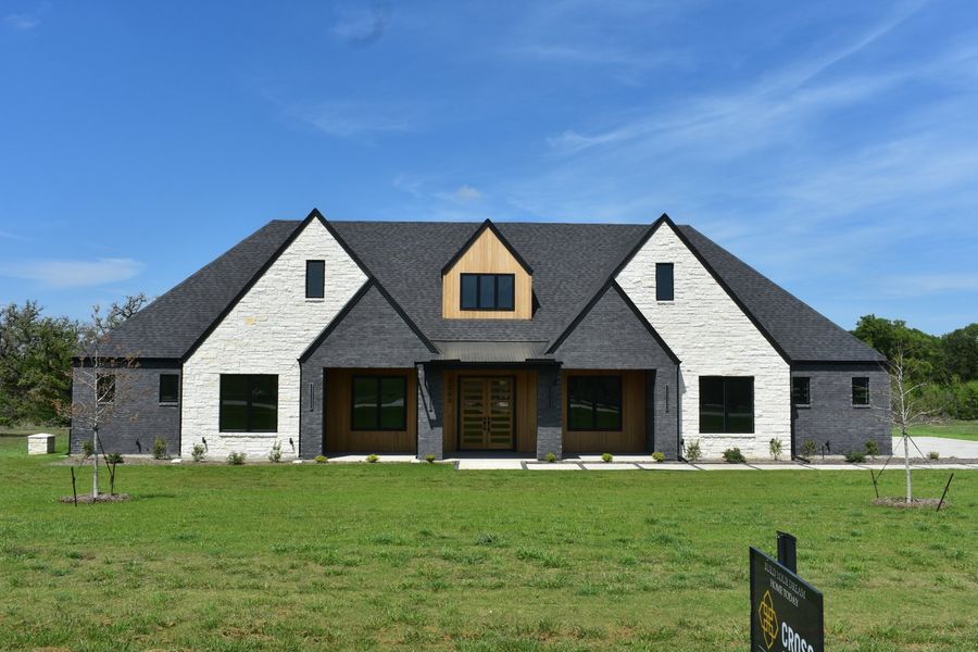 Front exterior of a new home in Summit Ranch, Aledo, TX, highlighting curb appeal (Image 1). Front exterior of a new home in Summit Ranch, Aledo, TX, highlighting curb appeal (Image 1).