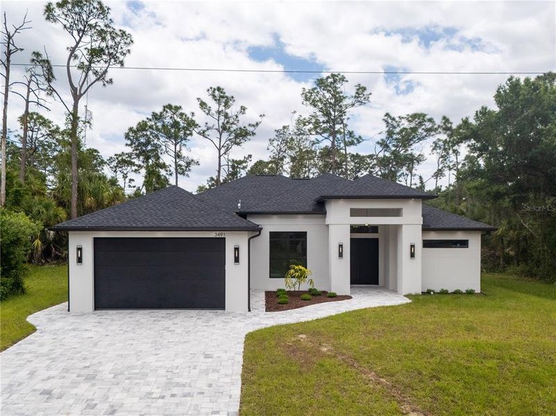 Front exterior of a new home in , North Port, FL, highlighting curb appeal (Image 31).