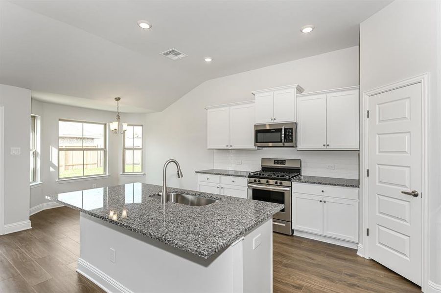 Granite Countertops, subway tile backsplash, stainless steel appliances