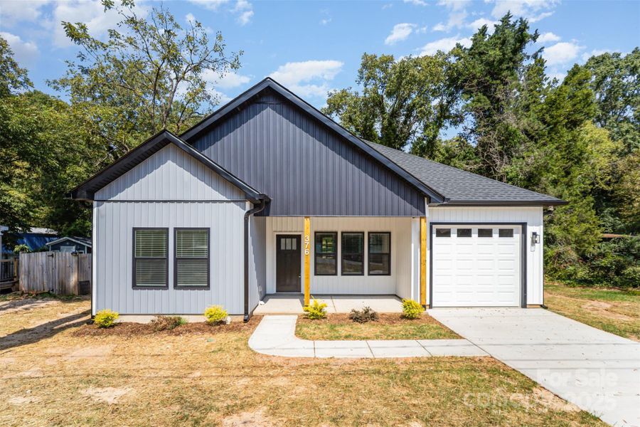 Front exterior of a new home in , Mooresville, NC, highlighting curb appeal (Image 1). Front exterior of a new home in , Mooresville, NC, highlighting curb appeal (Image 1).