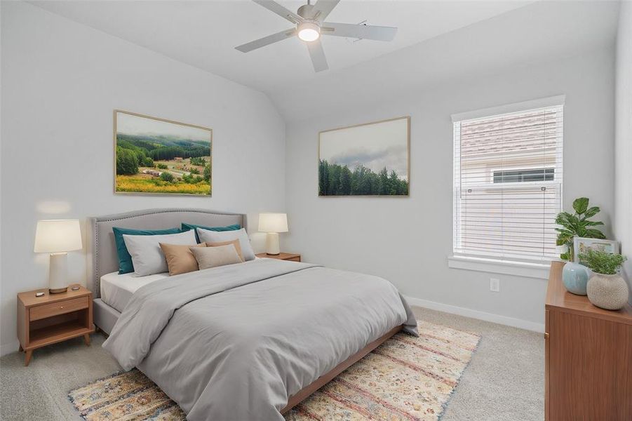 Secondary bedroom features plush carpet, custom paint, ceiling fan with lighting and a large window with privacy blinds.