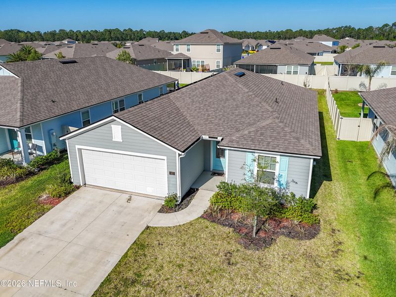 Front exterior of a new home in Dorado at Entrada, St. Augustine, FL, highlighting curb appeal (Image 28).