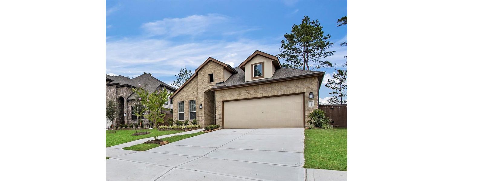 Front exterior of a new home in Wood Leaf Reserve, Tomball, TX, highlighting curb appeal (Image 24).
