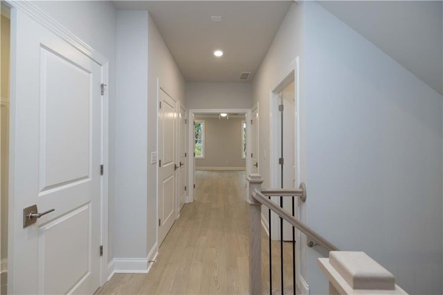 The laundry and linen closets are located conveniently on the second floor, next to the primary bedroom.*Please note photos shown are of the Ellington plan but not of the actual home..