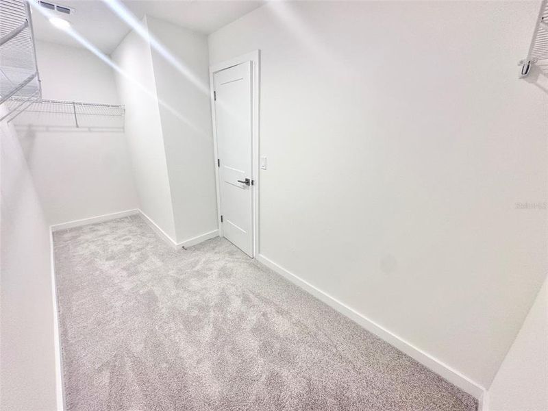 Spacious, unfurnished interior of a new home in Grasslands West, Lakeland (Image 34).