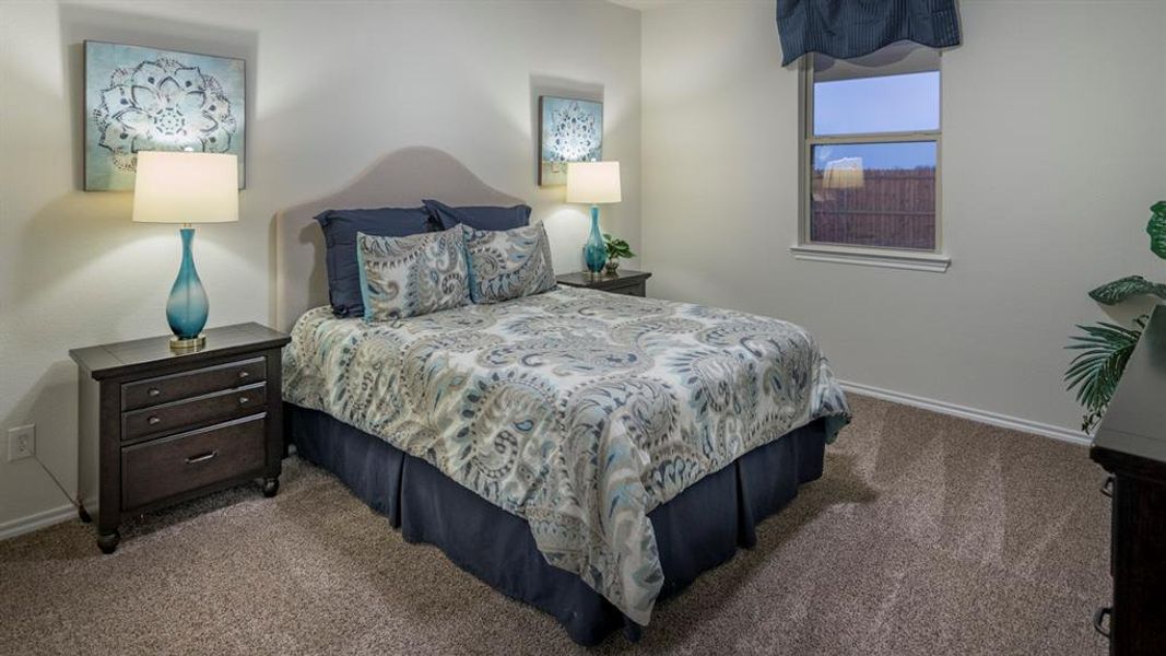 Bedroom with baseboards and carpet floors
