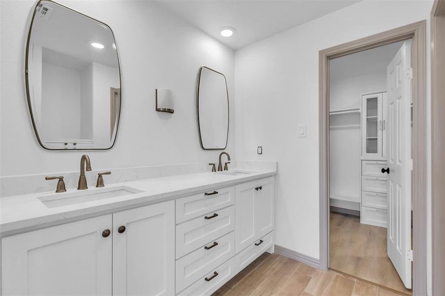 Bathroom with wood-type flooring and vanity