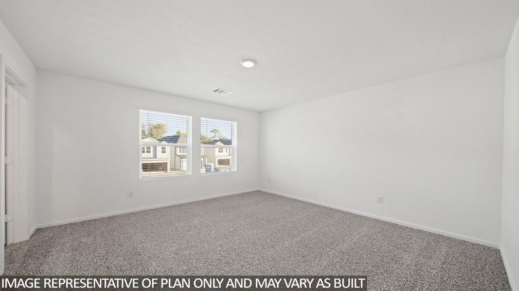 Spacious room featuring neutral carpeting and white wall finishes